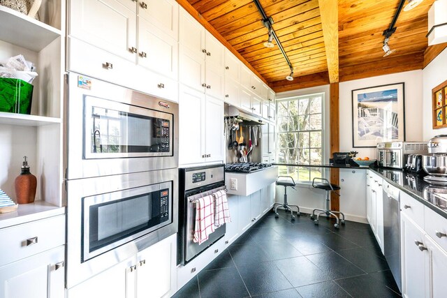 11 Allyn Ln, Barnstable, MA 02630 - kitchen with rail lighting, stainless steel appliances, white cabinetry, and wooden ceiling