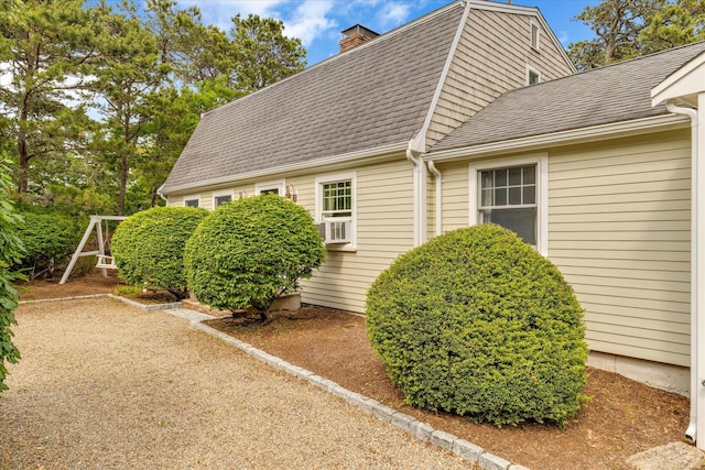 194 John Joseph Rd, Harwich, MA 02645 - view of side of home with a shingled roof, a chimney, and a gambrel roof