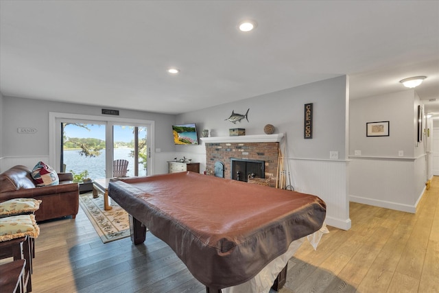 194 John Joseph Rd, Harwich, MA 02645 - rec room with light wood-style flooring, wainscoting, billiards table, a fireplace, and recessed lighting