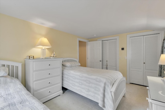 194 John Joseph Rd, Harwich, MA 02645 - bedroom featuring multiple closets, light carpet, and lofted ceiling