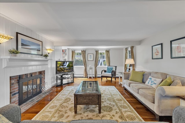 194 John Joseph Rd, Harwich, MA 02645 - living area with a brick fireplace and wood finished floors
