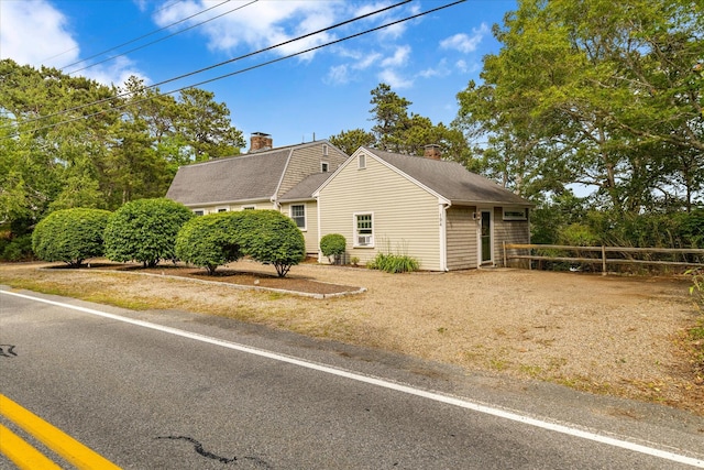 194 John Joseph Rd, Harwich, MA 02645 - view of side of property with a chimney and a shingled roof