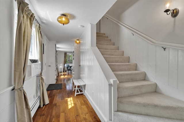 194 John Joseph Rd, Harwich, MA 02645 - entrance foyer featuring wood finished floors, a baseboard heating unit, stairway, a decorative wall, and cooling unit