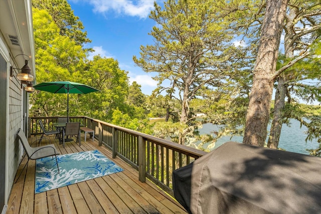 194 John Joseph Rd, Harwich, MA 02645 - deck featuring outdoor dining area, a water view, a grill, and view of scattered trees