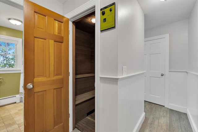 194 John Joseph Rd, Harwich, MA 02645 - corridor with a baseboard radiator and light wood finished floors