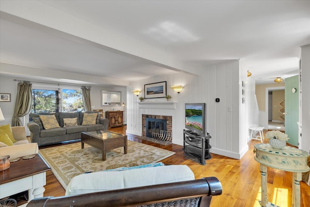 194 John Joseph Rd, Harwich, MA 02645 - living area featuring a brick fireplace and wood finished floors