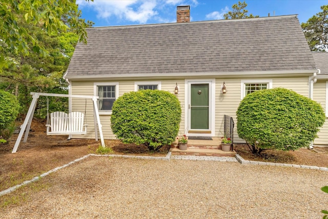 194 John Joseph Rd, Harwich, MA 02645 - view of front of house with a chimney, a shingled roof, and entry steps