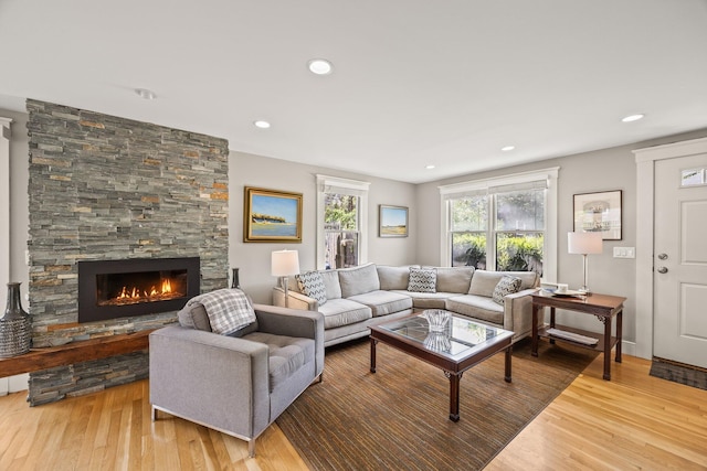 10 Seashore Park Dr Unit Ugg, Provincetown, MA 02657 - living area with wood finished floors, a stone fireplace, and recessed lighting