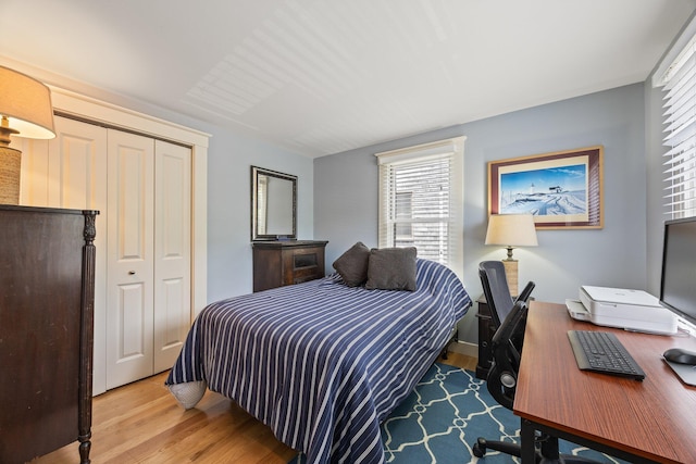 10 Seashore Park Dr Unit Ugg, Provincetown, MA 02657 - bedroom featuring wood finished floors, multiple windows, a closet, and an office area