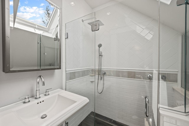 10 Seashore Park Dr Unit Ugg, Provincetown, MA 02657 - bathroom with a sink, a stall shower, and a skylight