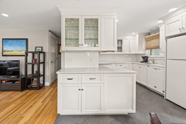 10 Seashore Park Dr Unit Ugg, Provincetown, MA 02657 - kitchen with white appliances, a sink, white cabinetry, recessed lighting, and decorative backsplash