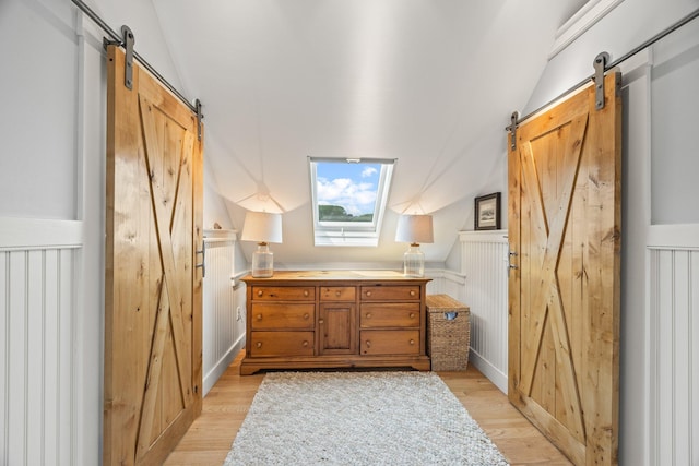10 Seashore Park Dr Unit Ugg, Provincetown, MA 02657 - bathroom featuring wood finished floors and vaulted ceiling