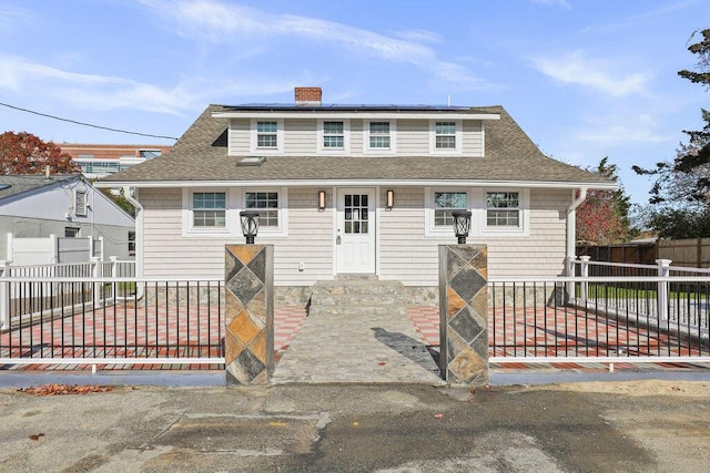 bungalow-style home with solar panels