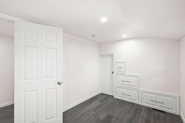 unfurnished room with dark hardwood / wood-style floors