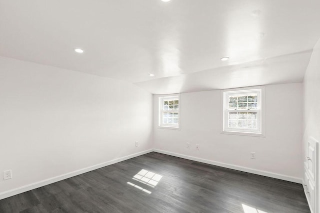 unfurnished room featuring dark hardwood / wood-style flooring