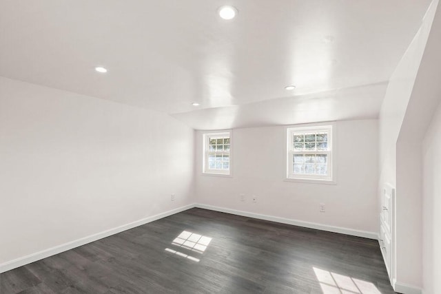 spare room with dark hardwood / wood-style floors