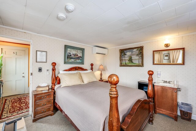 bedroom featuring light colored carpet, ornamental molding, and a wall mounted AC