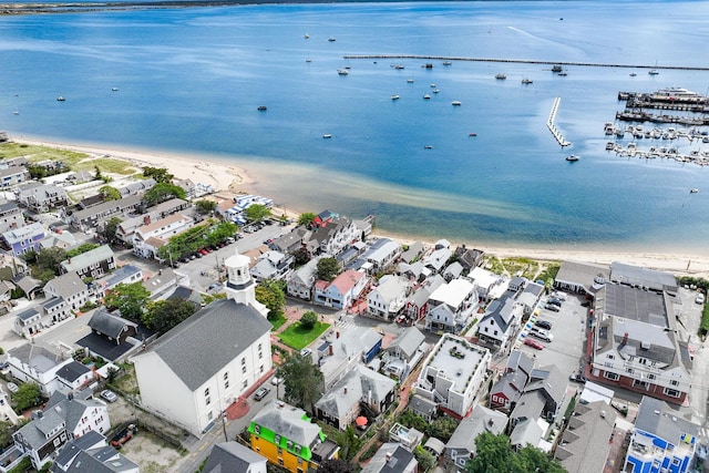 drone / aerial view with a water view and a view of the beach