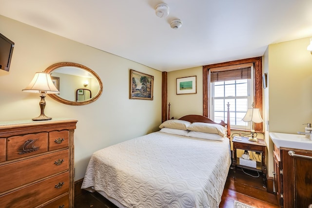 bedroom featuring dark wood-type flooring