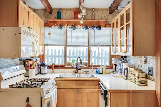 kitchen with white appliances, sink, beam ceiling, backsplash, and light brown cabinets