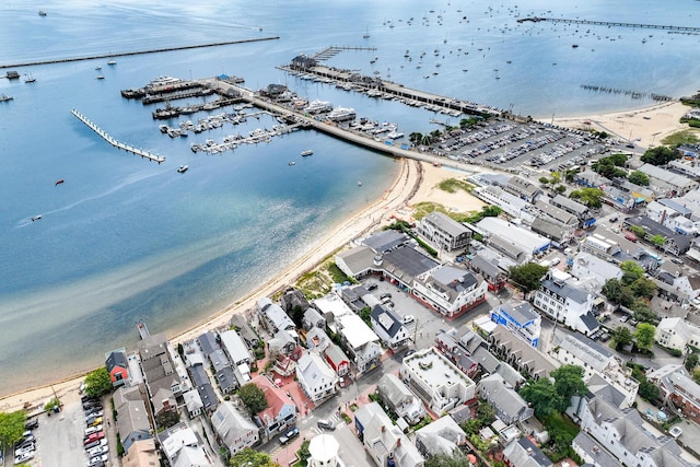 birds eye view of property featuring a beach view and a water view