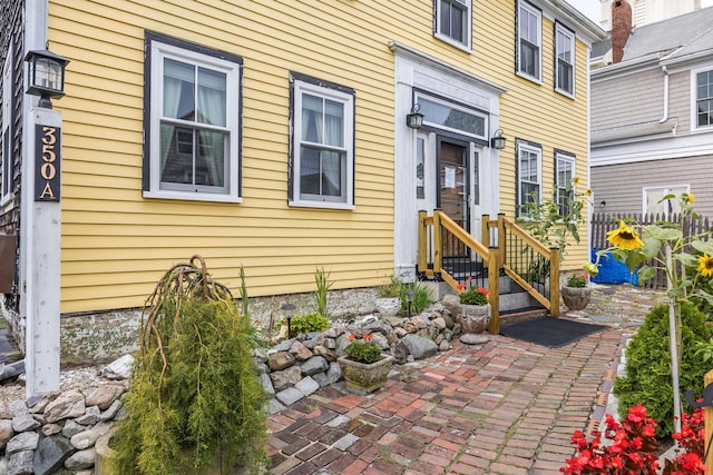 property entrance featuring a patio