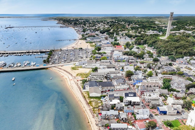 drone / aerial view featuring a water view and a view of the beach