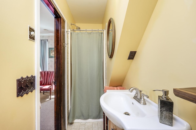 bathroom featuring sink and a shower with curtain