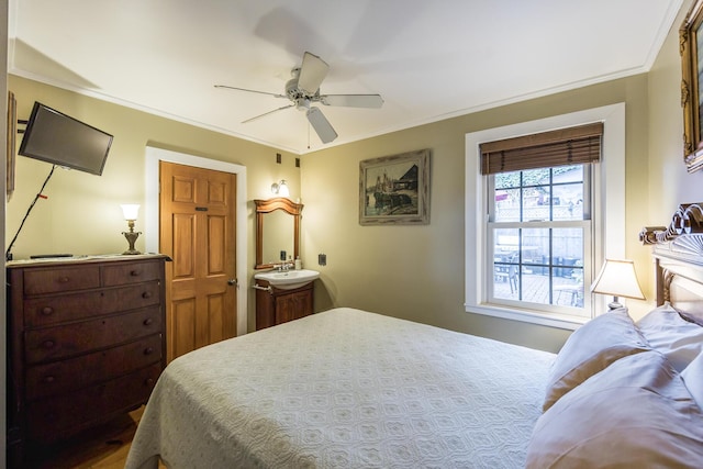 bedroom with ceiling fan and crown molding