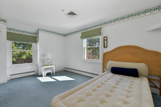 carpeted bedroom featuring a baseboard radiator