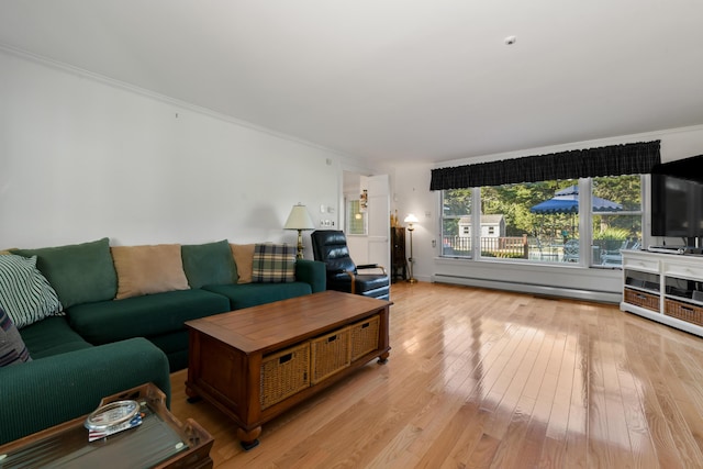 living room featuring a baseboard radiator, crown molding, and light wood-type flooring