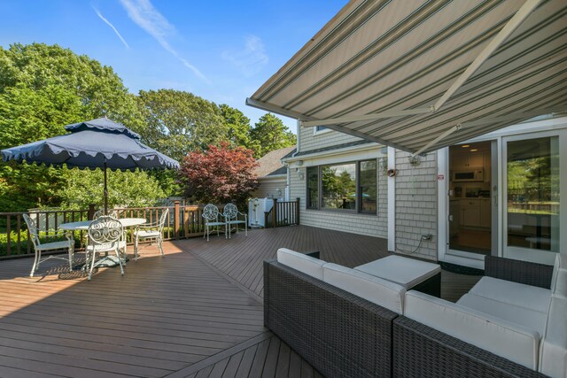 wooden terrace featuring an outdoor living space