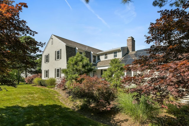 view of property exterior with a lawn