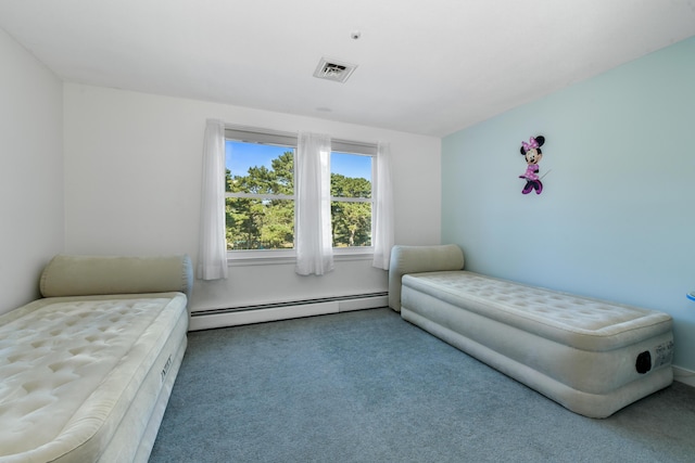 bedroom featuring a baseboard heating unit and carpet flooring