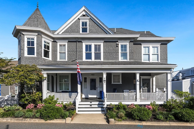 165 Commercial St Unit 4, Provincetown, MA 02657 - victorian-style house featuring covered porch and roof with shingles