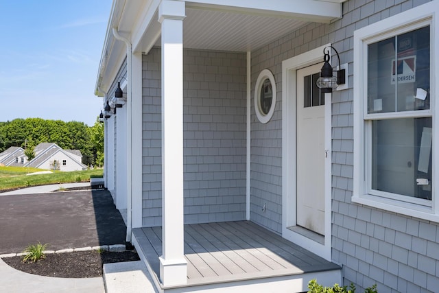 doorway to property with a porch