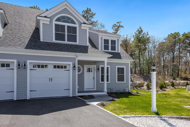 213 N Falmouth Hwy Unit 5A, North Falmouth, MA 02556 - view of front of home featuring aphalt driveway, a shingled roof, and a front yard