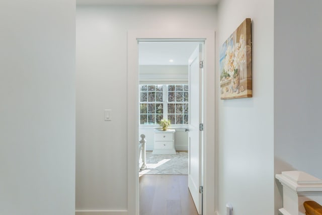 corridor featuring wood finished floors