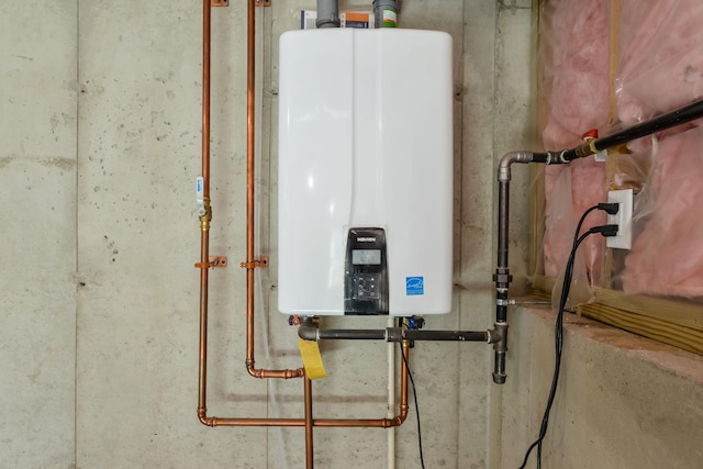 utility room with tankless water heater