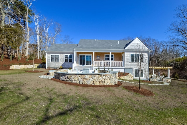 back of property with a pergola, a lawn, a patio area, and roof with shingles
