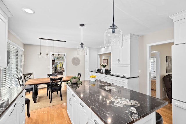 39 Fox Run Ln, East Falmouth, MA 02536 - kitchen with freestanding refrigerator, white cabinets, light wood-style floors, and recessed lighting