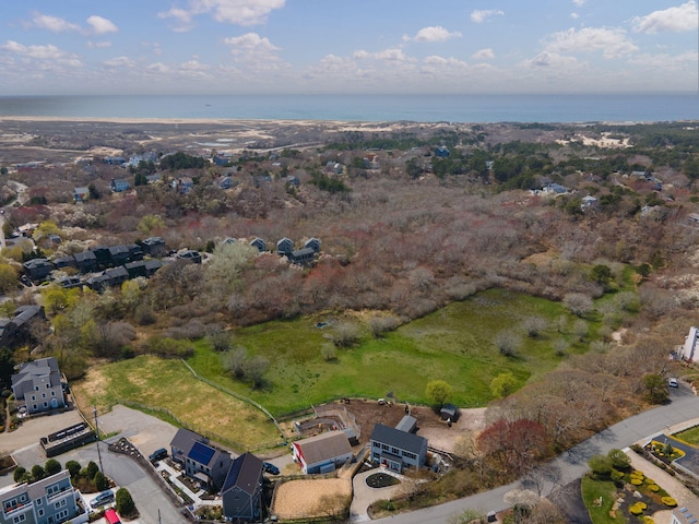 aerial view of property and surrounding area featuring a large body of water