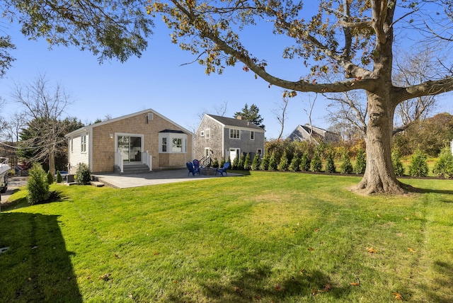 view of yard with entry steps and a patio