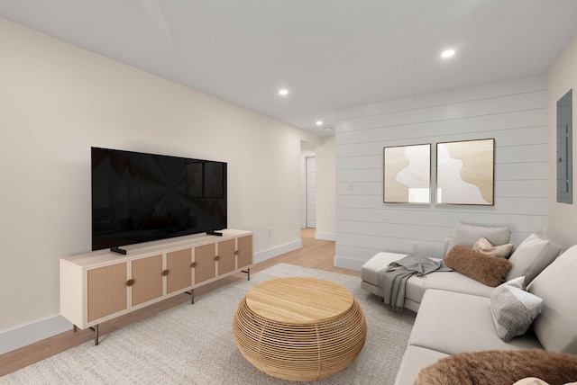 living room featuring recessed lighting, light wood-style flooring, and baseboards