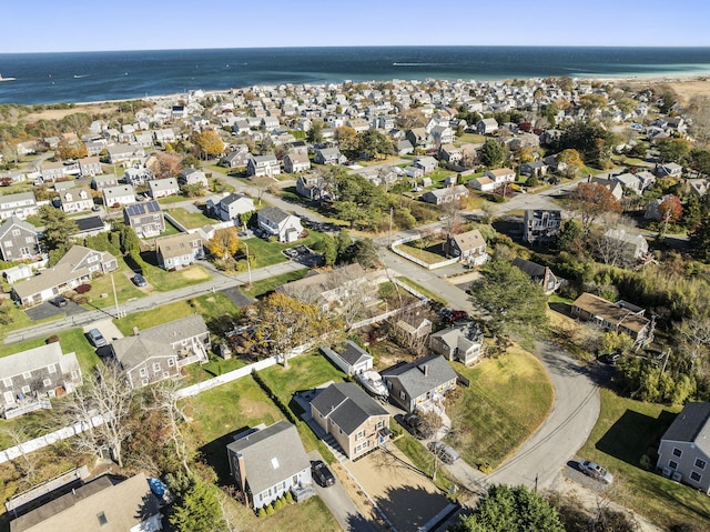 drone / aerial view featuring a residential view and a water view