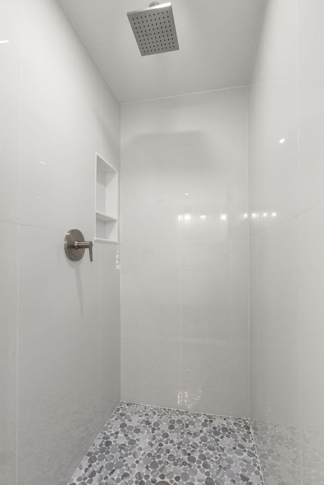 full bathroom with tiled shower