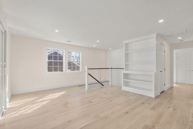 unfurnished room featuring visible vents, recessed lighting, light wood-style flooring, and baseboards