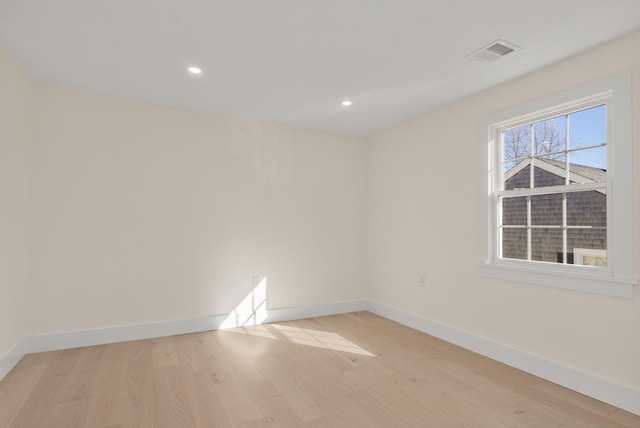 unfurnished room featuring baseboards, recessed lighting, visible vents, and light wood-style floors