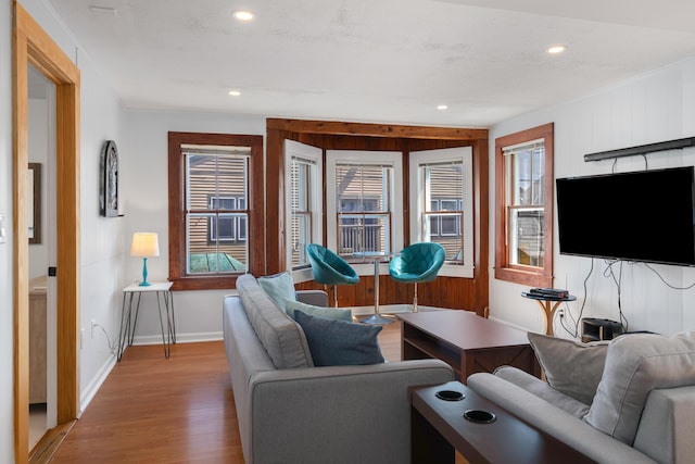 living room with a textured ceiling and light wood-type flooring