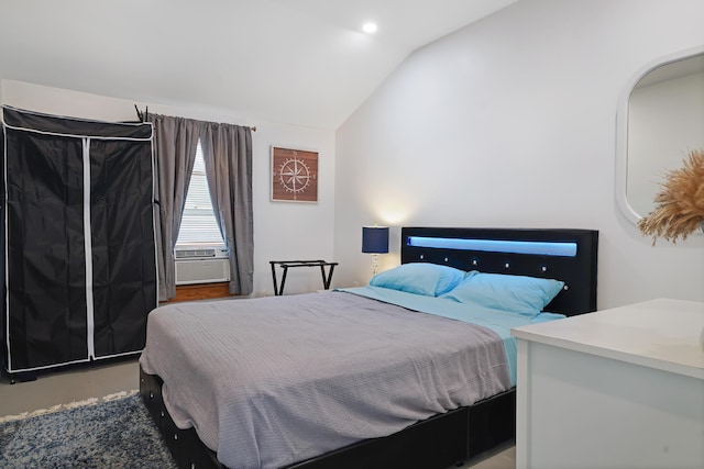 bedroom featuring cooling unit and lofted ceiling